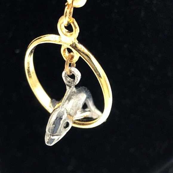 Silver tone dolphin jumping through gold tone hoop earrings - Picture 6 of 6